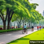 Home 21 탄소 격리 식재 프로젝트의 기후 변화 대응 전략 - A vibrant urban park scene in Hanoi, Vietnam, showcasing a diverse mix of mature and young trees alo...